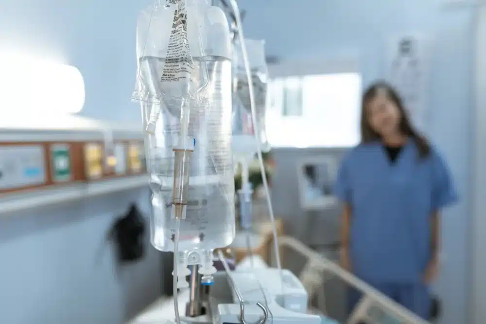 Patient receiving intravenous hydration therapy at an evening urgent care clinic