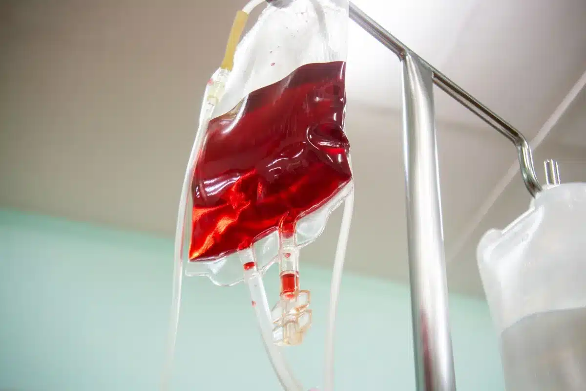 Nurse preparing IV infusion therapy bag at an urgent care clinic in Oak Lawn Dallas TX