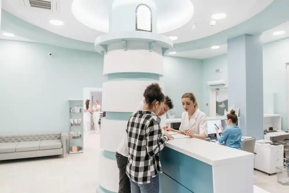Patient checking in at a walk-in urgent care clinic for same-day UTI testing