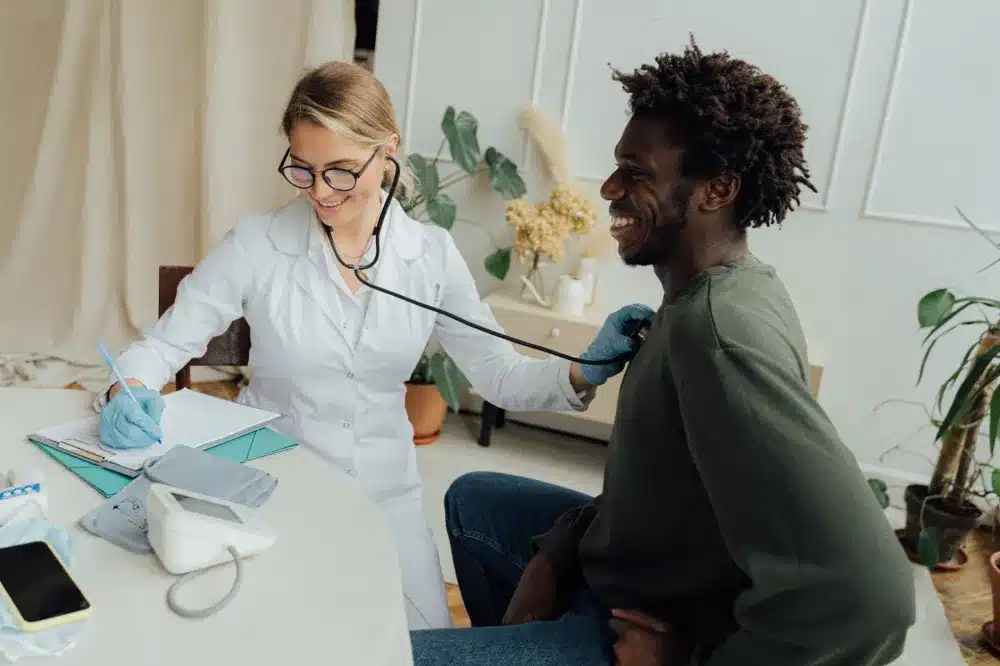 Urgent care provider discussing UTI treatment options with patient in Burleson Texas clinic