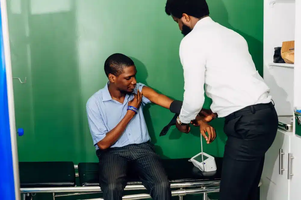 Nurse checking patient blood pressure during a primary care visit in Arlington Texas