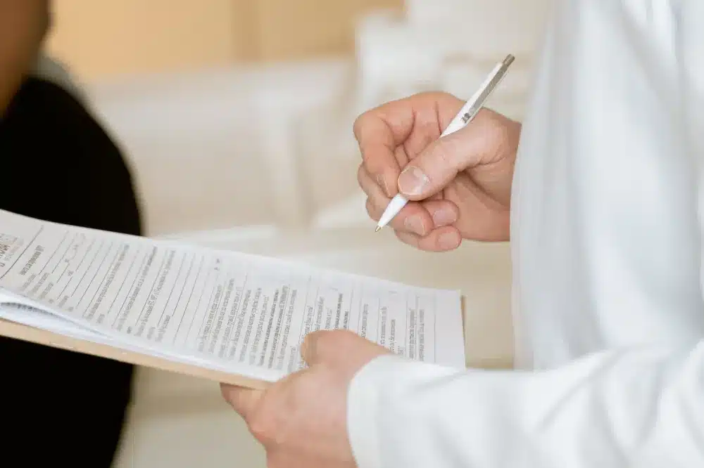 Primary care doctor reviewing patient health history during an annual physical exam