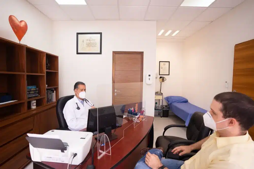 Doctor reviewing autoimmune symptoms with a patient during a rheumatology consultation