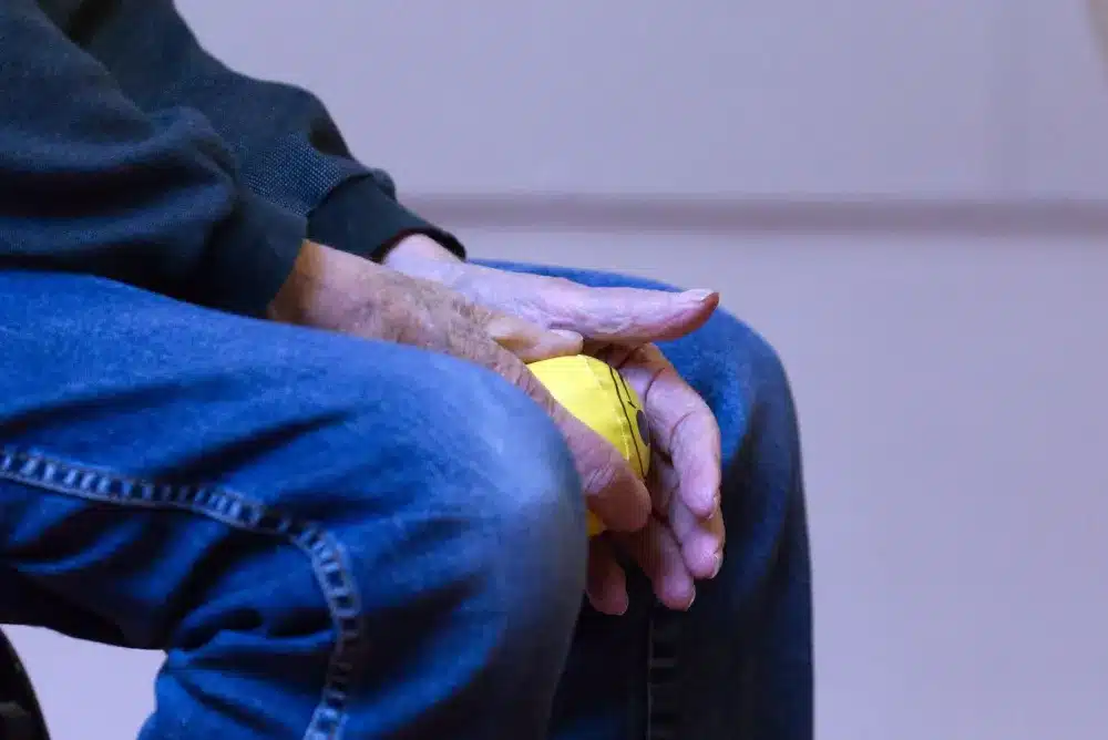 Close-up of swollen finger joints, a common autoimmune symptom prompting rheumatology care